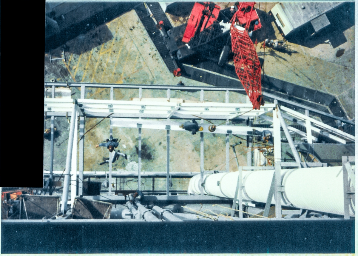 Viewed from a vantage point 70 feet above them, two Union Ironworkers from Local 808 working for Ivey Steel at Space Shuttle Launch Complex 39-B, Kennedy Space Center, Florida, walk high steel during their workday assembling the PCR Anteroom along the back side of the Rotating Service Structure.